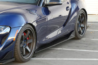 The APR carbon fiber aero kit for the MKV 2020+ Toyota Supra includes front lip, side skirts and rear bumper skirts (AB-330920) installed showing side skirts