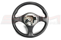 Mitsubishi OEM Evo 9 Black Momo Steering Wheel MN100378XB Image © STM Tuned Inc